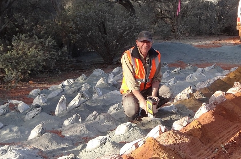 Steven Cooper using a pXRF unit on drill samples - July 2014.